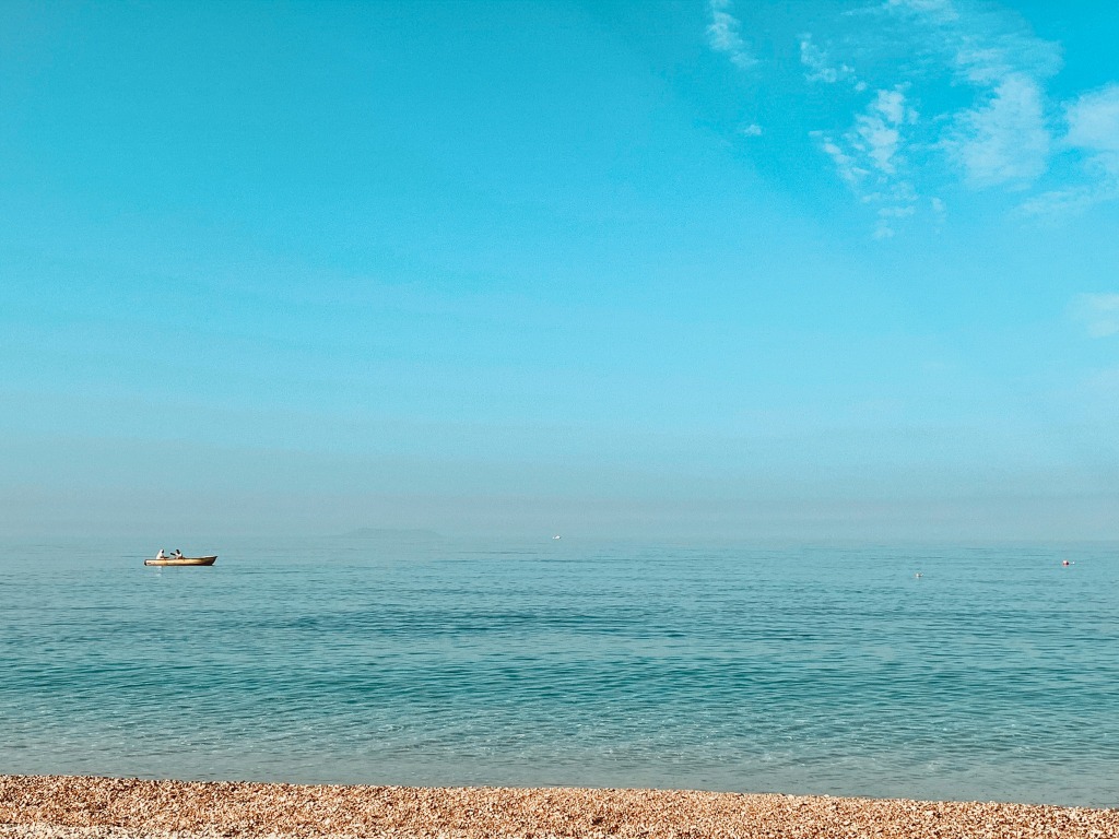 beautiful view of the sea and a fisherman